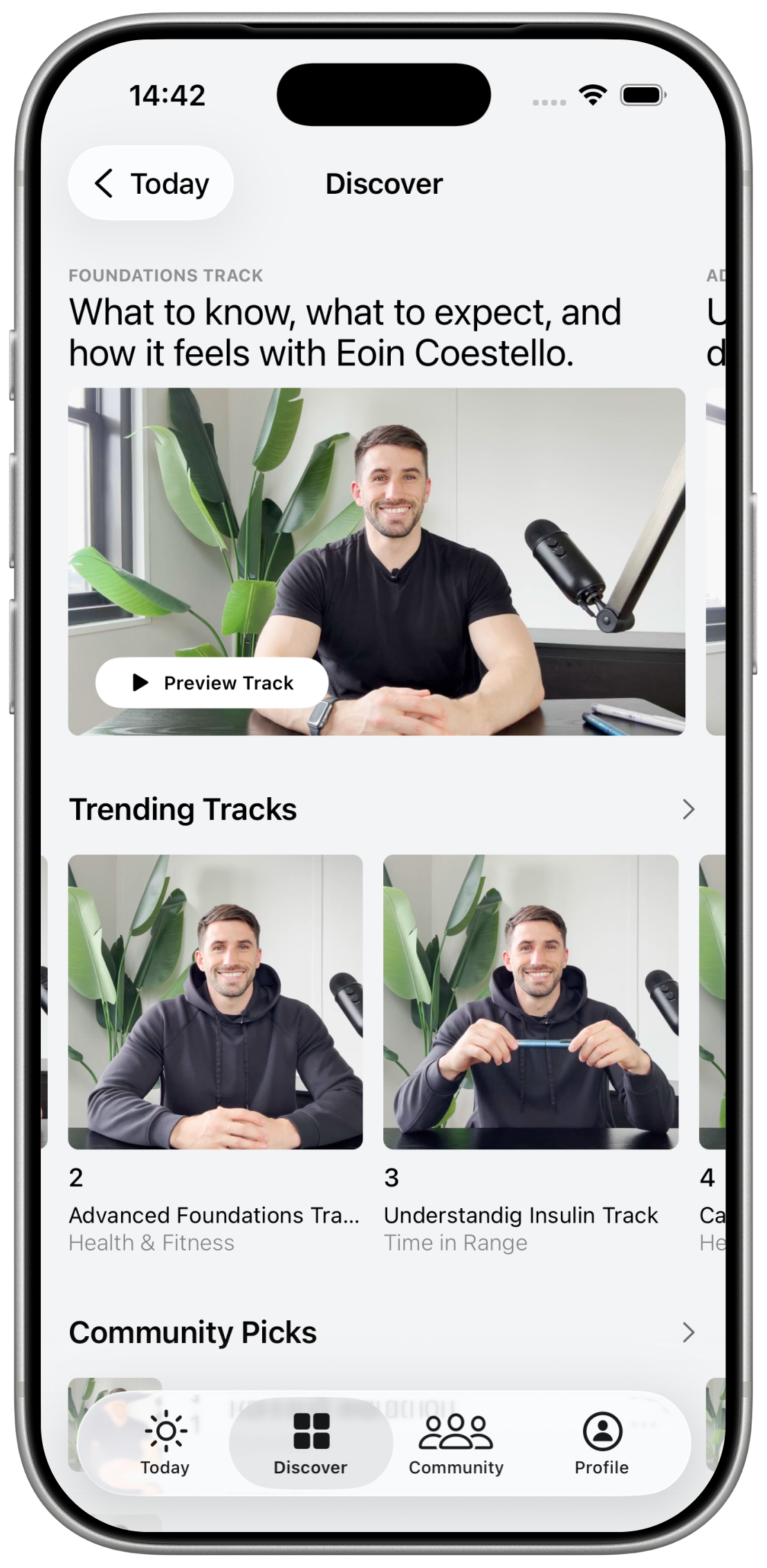 iPhone showing the stable app Discover screen with tracks.